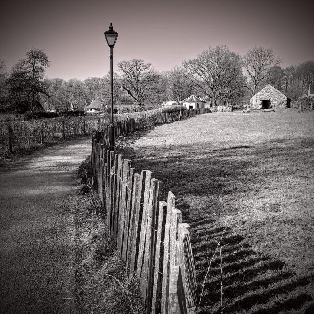 A lane leading up to a South Wales house with a short winding road leading to the farmhouse