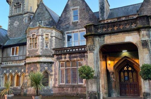 A retro vintage imge of barry island showing the beach and promenade, the funfair and butlins holiday camp